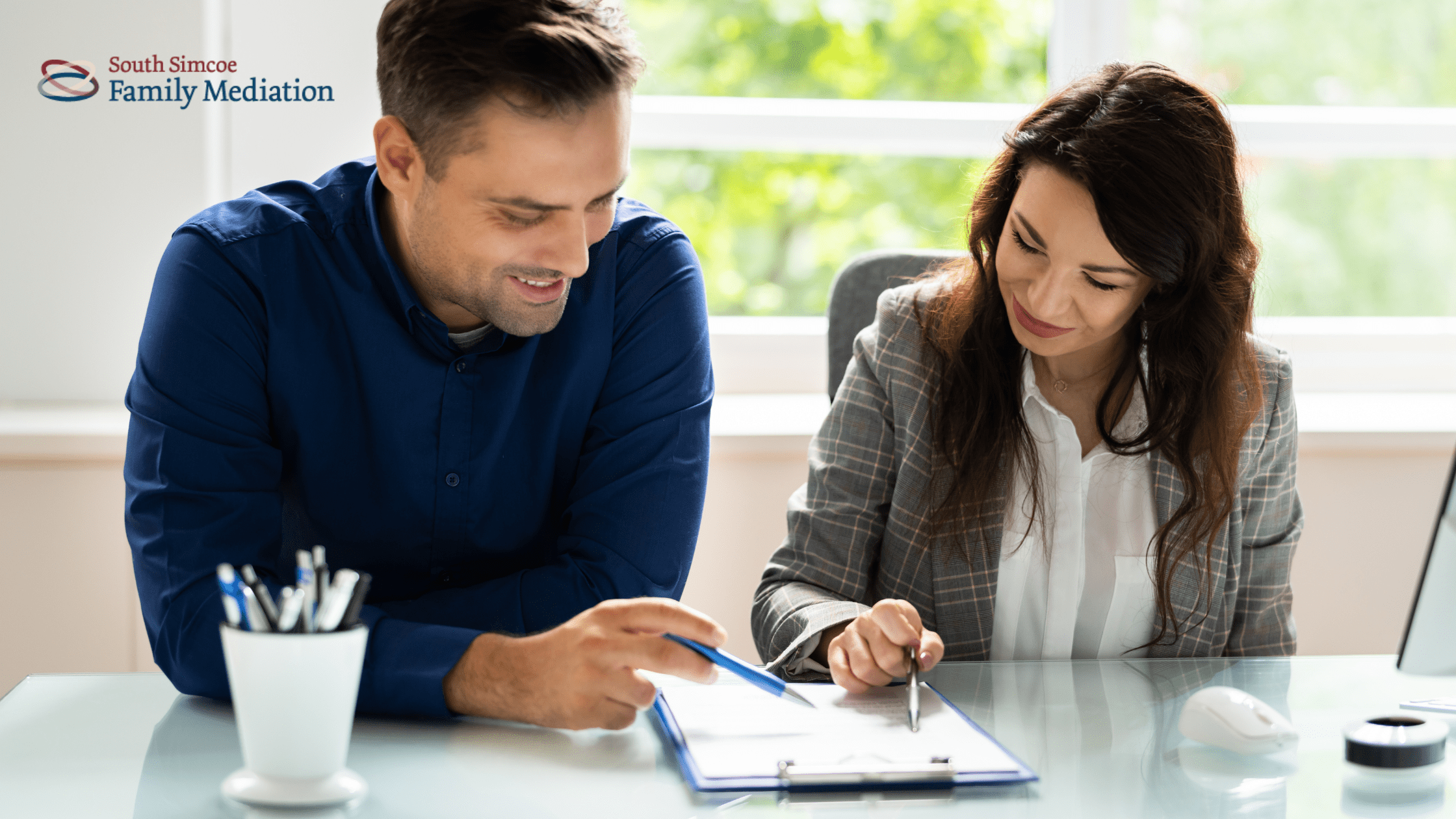 Divorcing couple discussing separation agreement through mediation
